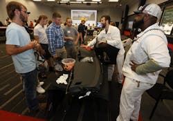 Honda associates share details about creating an instrument panel to students from Urbana High School. Honda associates share details about creating an instrument panel to students from Urbana High School.