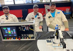 Honda robotics associates were ready to chat. Students could operate a small robot, picking up letters to spell their name, and play around with the human-machine interface. Honda robotics associates were ready to chat. Students could operate a small robot, picking up letters to spell their name, and play around with the human-machine interface.