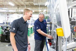 An apprentice at Bosch Charleston, left, with a Bosch trainer.