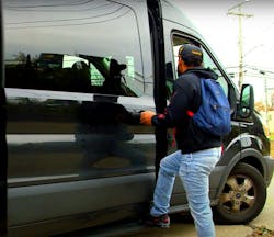 A worker climbs into a Get2Work Now van in Cleveland. A worker climbs into a Get2Work Now van in Cleveland.