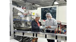 Employees inspect parts at Hoffer Plastics. Employees inspect parts at Hoffer Plastics.