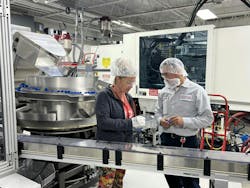 Employees inspect parts at Hoffer Plastics. Employees inspect parts at Hoffer Plastics.