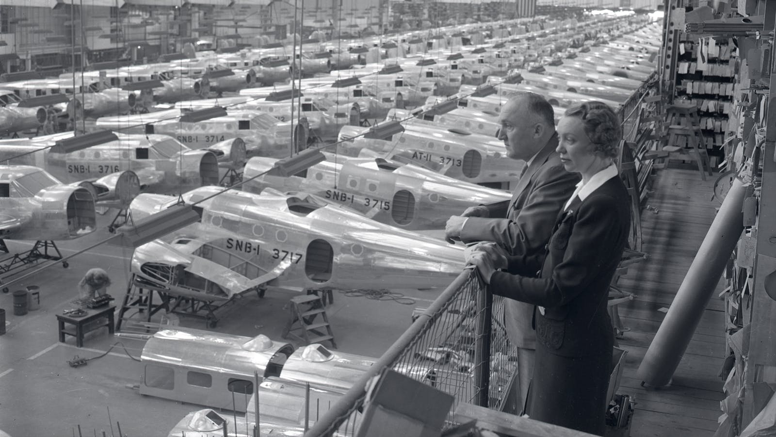 Olive Ann and Walter Beech, the founders of Beech Aircraft Corporation overseeing the production of military aircraft that were used in World War II.
