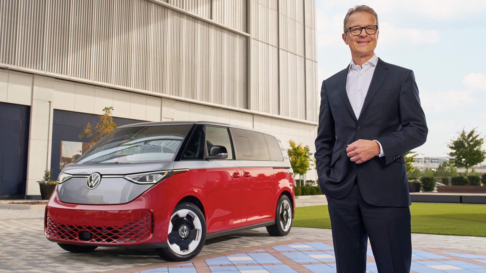Incoming CEO of Volkswagen Group of America Kjell Gruner next to VW vehicle
