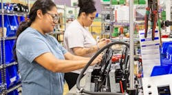 Two women on production line at HindlePower Two women on production line at HindlePower