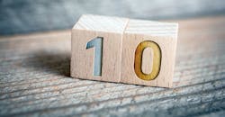 Two wooden blocks displaying the number ten. Two wooden blocks displaying the number ten.