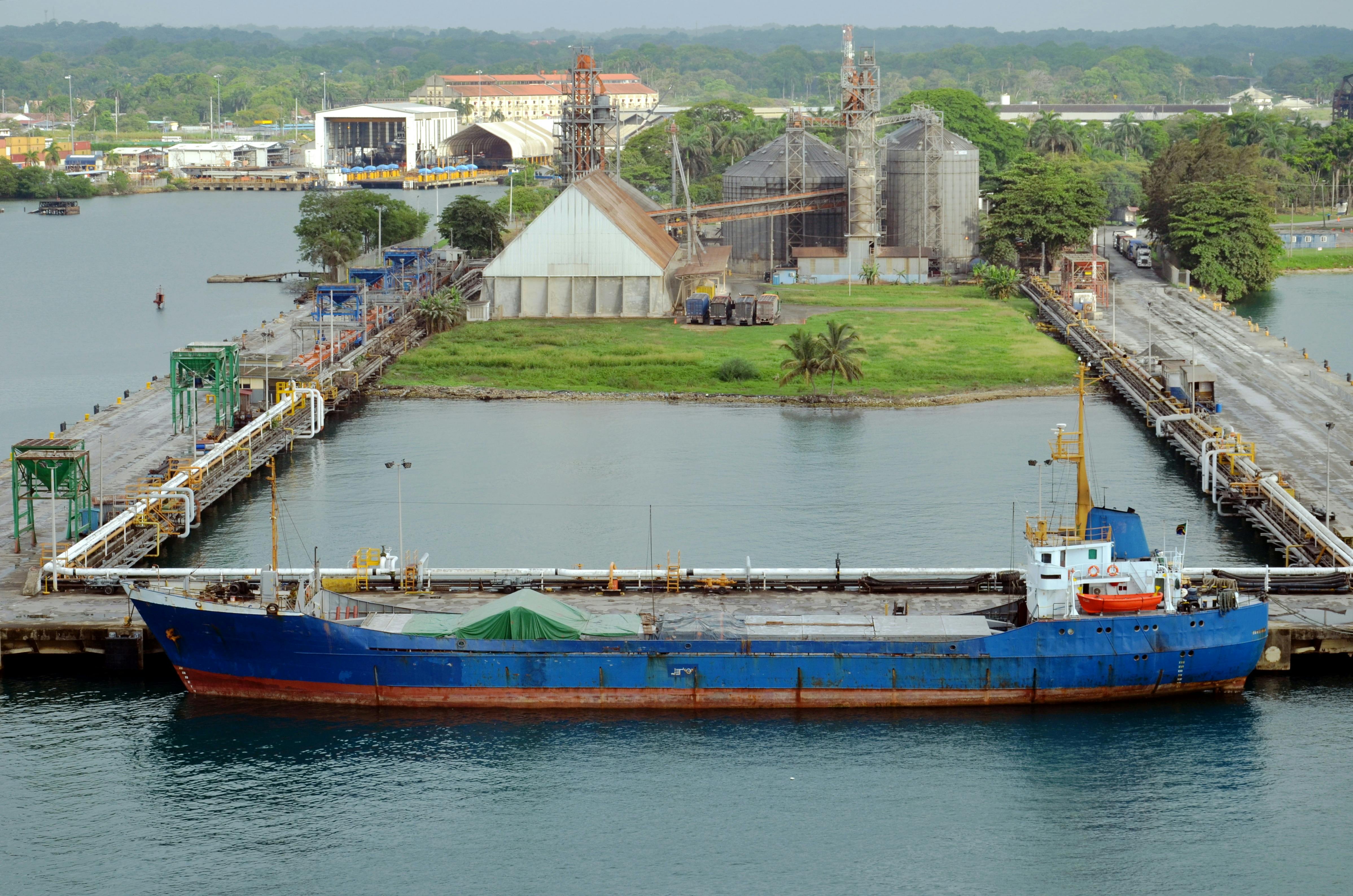 A ship waits at the Panamanian port at Cristobal, one of two ports being divested from Chinese ownership to a U.S.-Italian partnership.