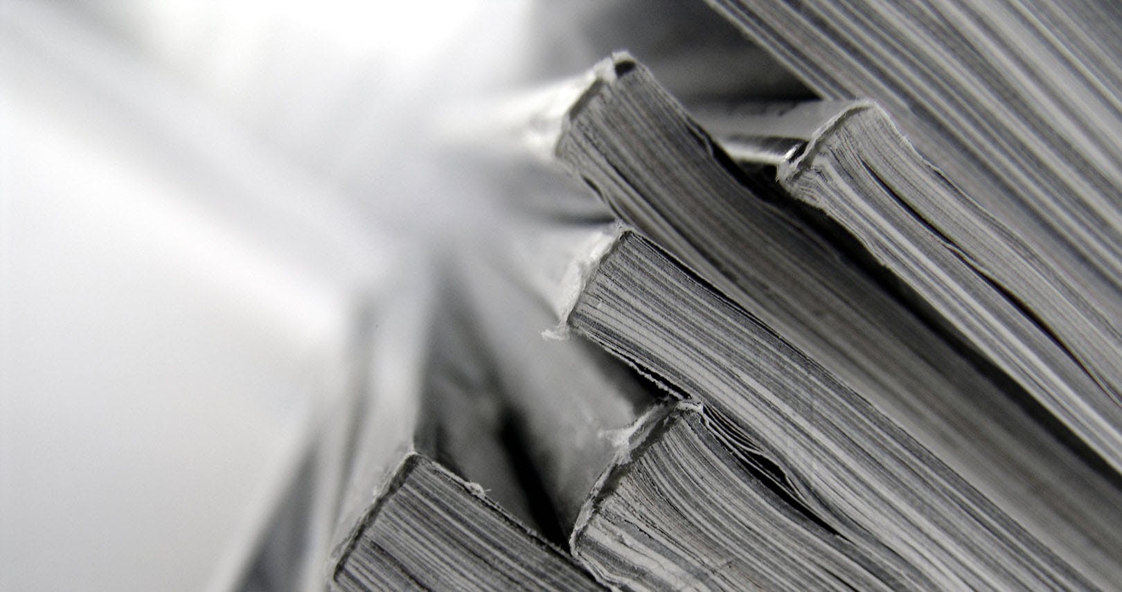 close up of the spine of several magazines