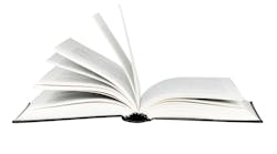 closeup of open book against white background closeup of open book against white background