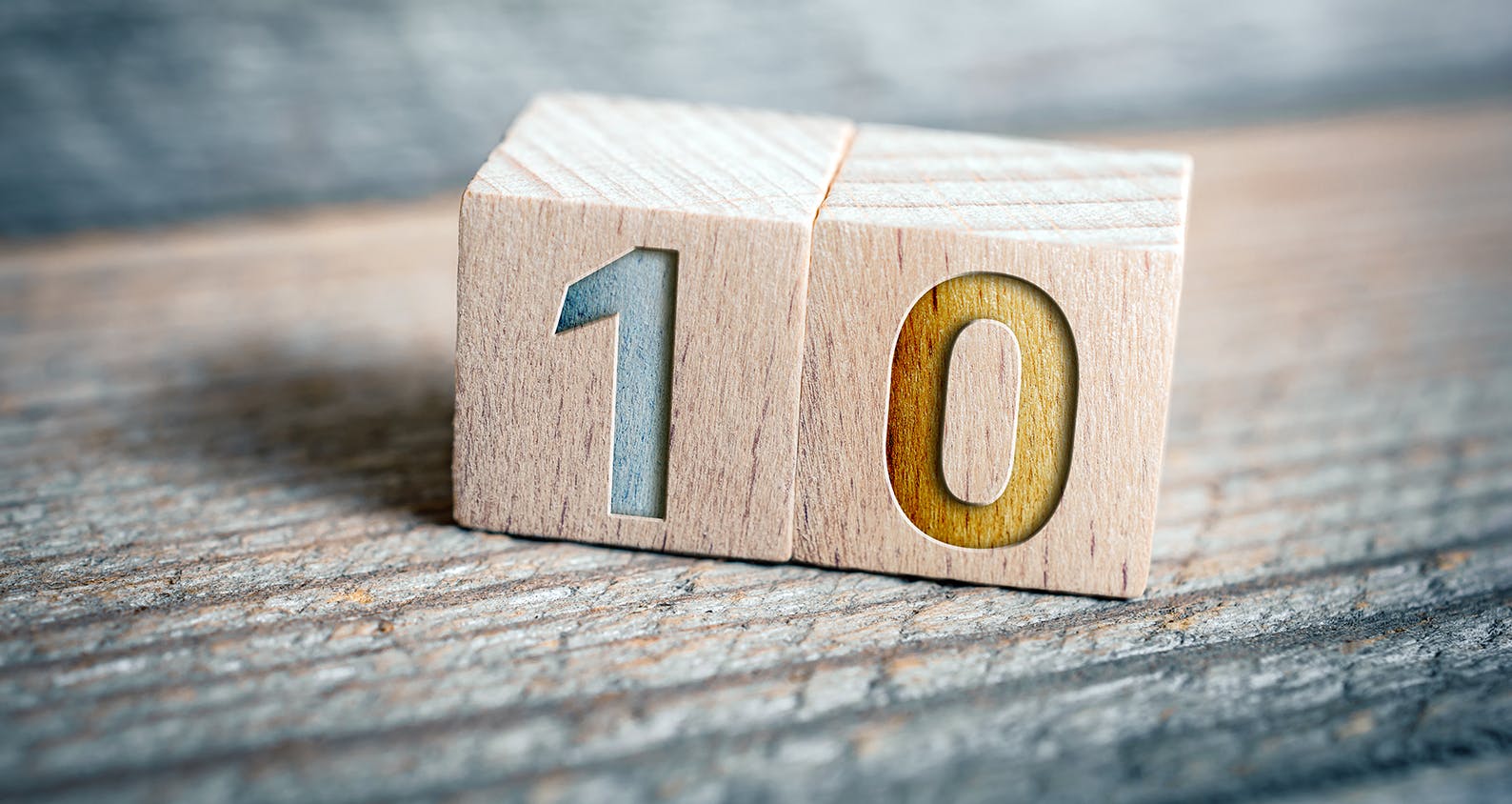 two wooden blocks showing the number ten