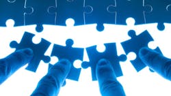 puzzle pieces being pushed into place puzzle pieces being pushed into place