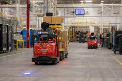 Automatic Guided Vehicles (AGVs) pull trains of product through the plant. Automatic Guided Vehicles (AGVs) pull trains of product through the plant.
