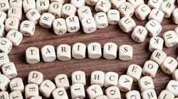 Word tariffs in letters on cube dice on table. Word tariffs in letters on cube dice on table.