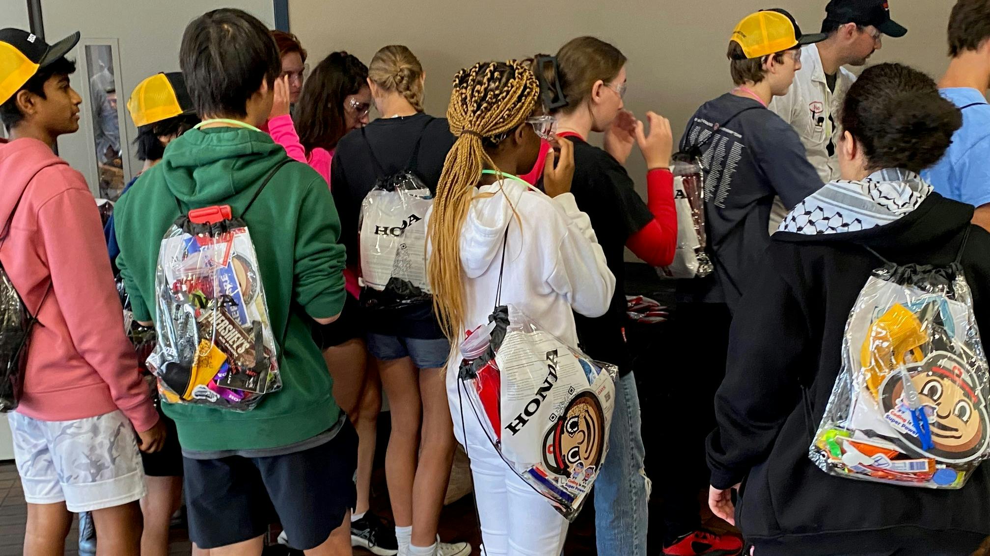 High school students and their swag bags at Honda Marysville's Manufacturing Day, 2023.