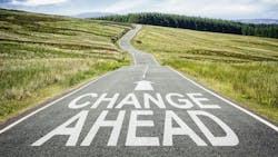 Image of a long road with an arrow and the words 'Change Ahead.' Image of a long road with an arrow and the words 'Change Ahead.'