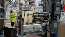 Once stretched to extreme thinness, employees roll shrink wrap films on rollers before sending them to customers who will wrap frozen pizzas, pallets of tissue paper, pharmaceuticals and other products with the plastic. Once stretched to extreme thinness, employees roll shrink wrap films on rollers before sending them to customers who will wrap frozen pizzas, pallets of tissue paper, pharmaceuticals and other products with the plastic.