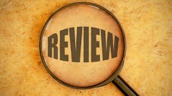 magnifying glass focused on the word 'review' magnifying glass focused on the word 'review'