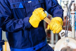 Mechanic repairing machine in industrial plant. Mechanic repairing machine in industrial plant.