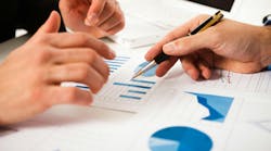 Business people discussing data during a meeting. Business people discussing data during a meeting.