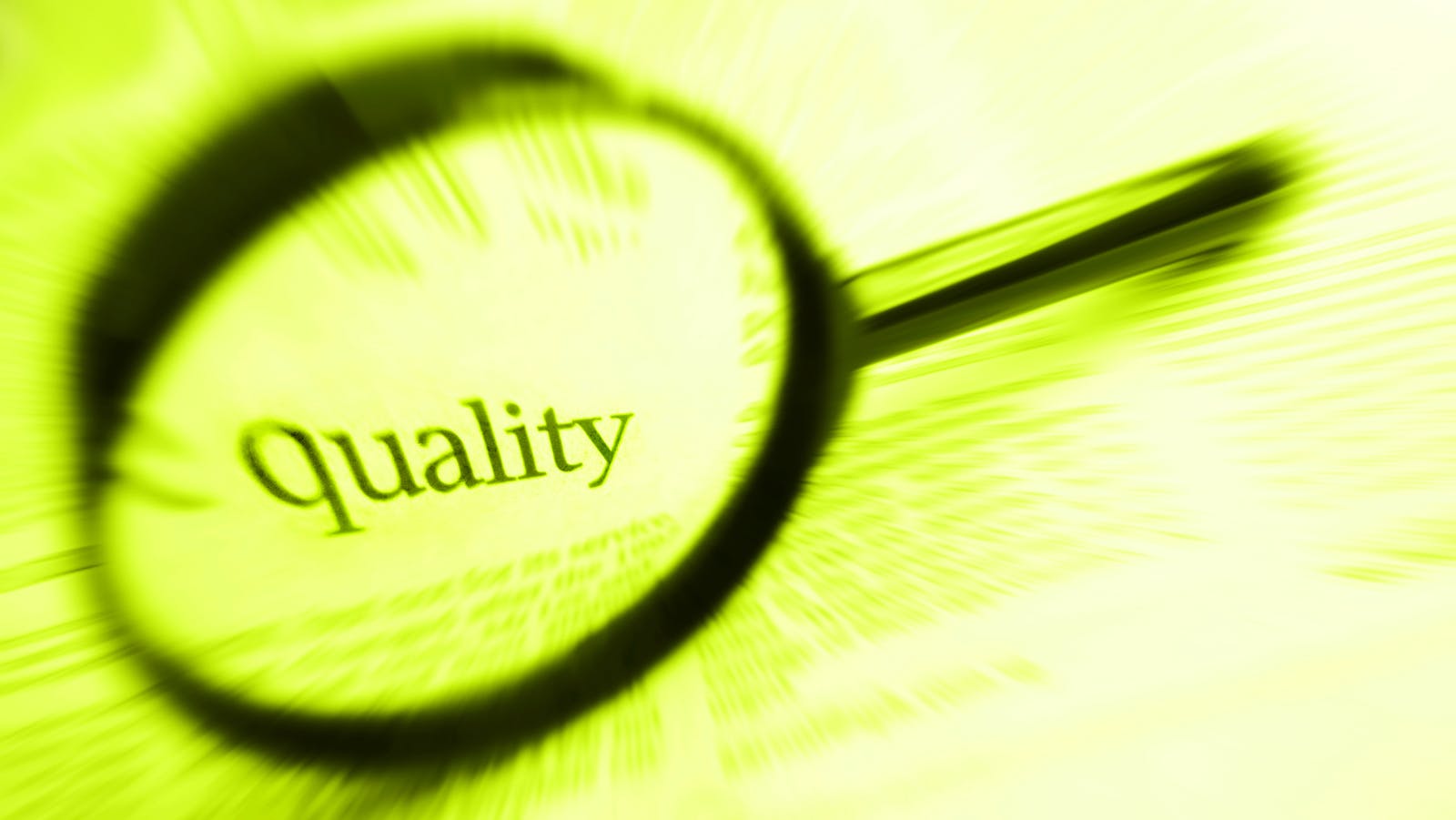 the word 'quality' inside a magnifying glass