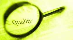 the word 'quality' inside a magnifying glass the word 'quality' inside a magnifying glass