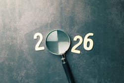 Looking ahead to the year 2026 with a magnifying glass. Looking ahead to the year 2026 with a magnifying glass.