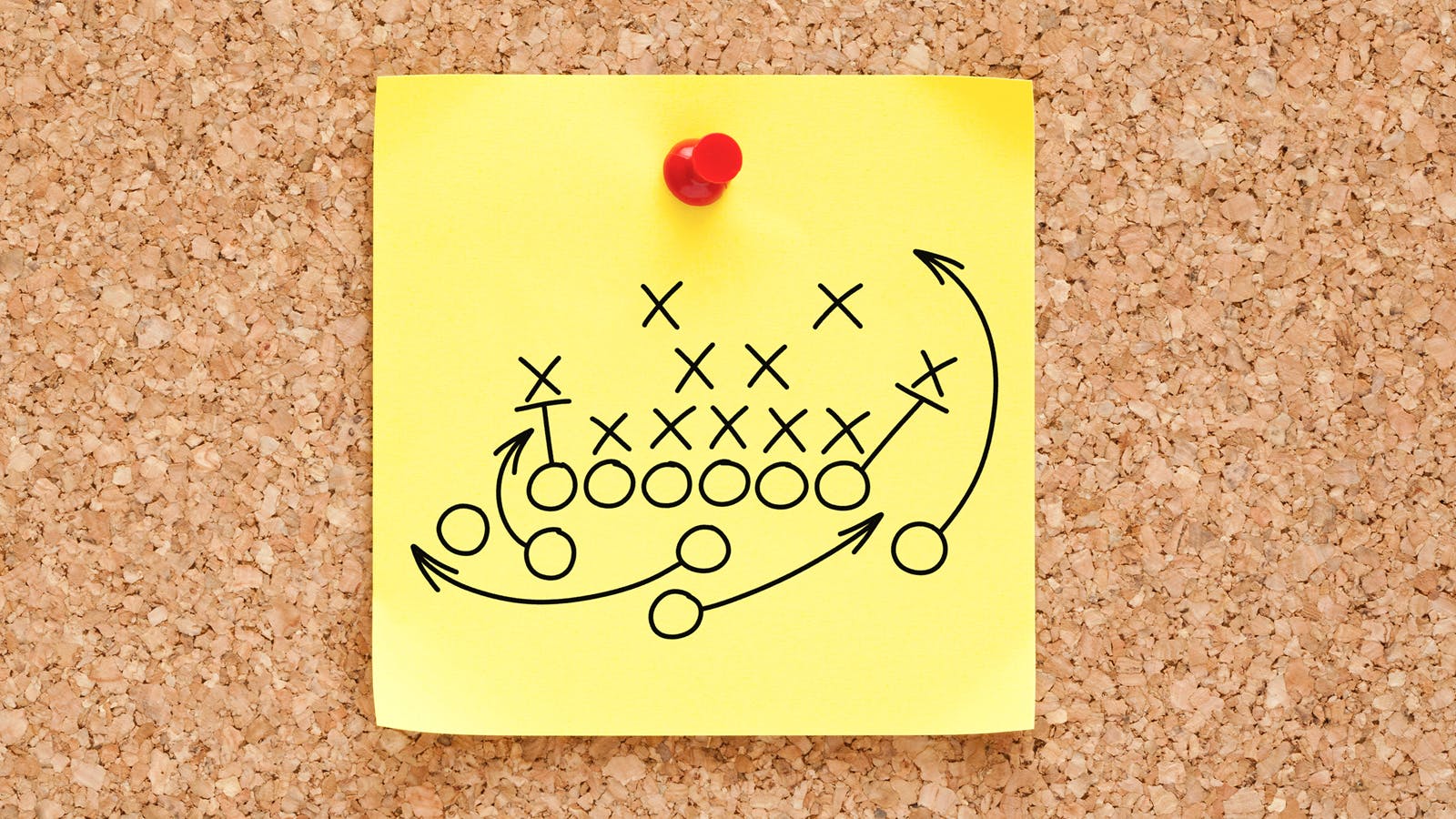 Post-It Note on a Cork Board with a Sports Play on it.