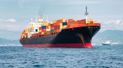Commercial cargo ship carrying containers Commercial cargo ship carrying containers