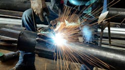 Welder working at factory Welder working at factory