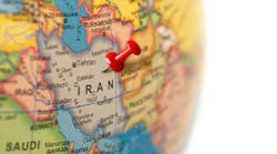 Earth globe close up with a red pin in Iran. Earth globe close up with a red pin in Iran.