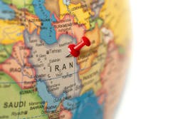 Earth globe close up with a red pin in Iran. Earth globe close up with a red pin in Iran.