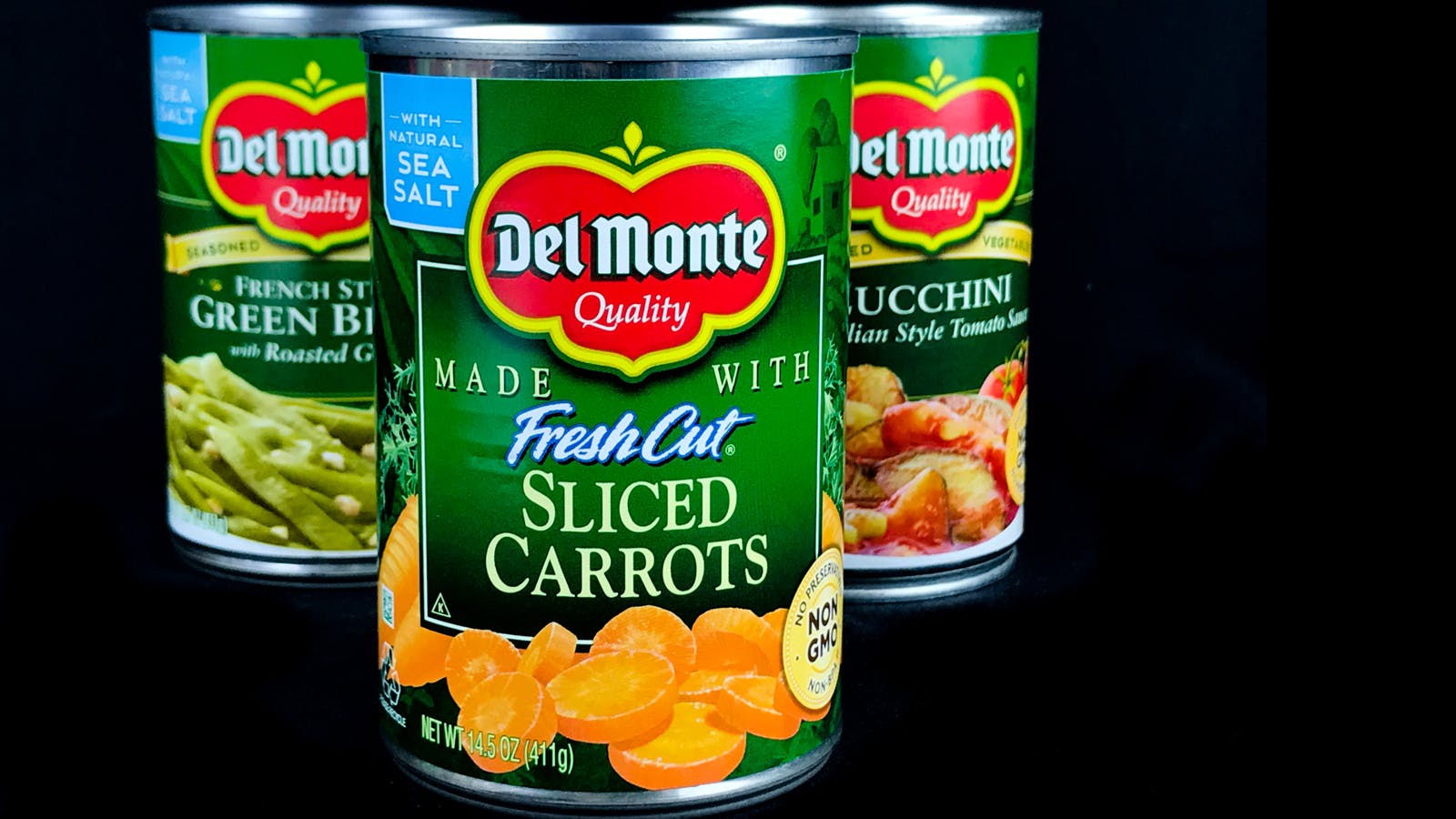 3 cans of Del Monte vegetables: green beans, carrots and zucchini