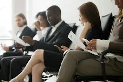 Applicants sitting in queue waiting for job interview Applicants sitting in queue waiting for job interview