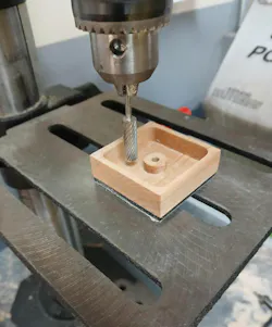 machine hollows out wood block to create part of the rubber stamp machine hollows out wood block to create part of the rubber stamp