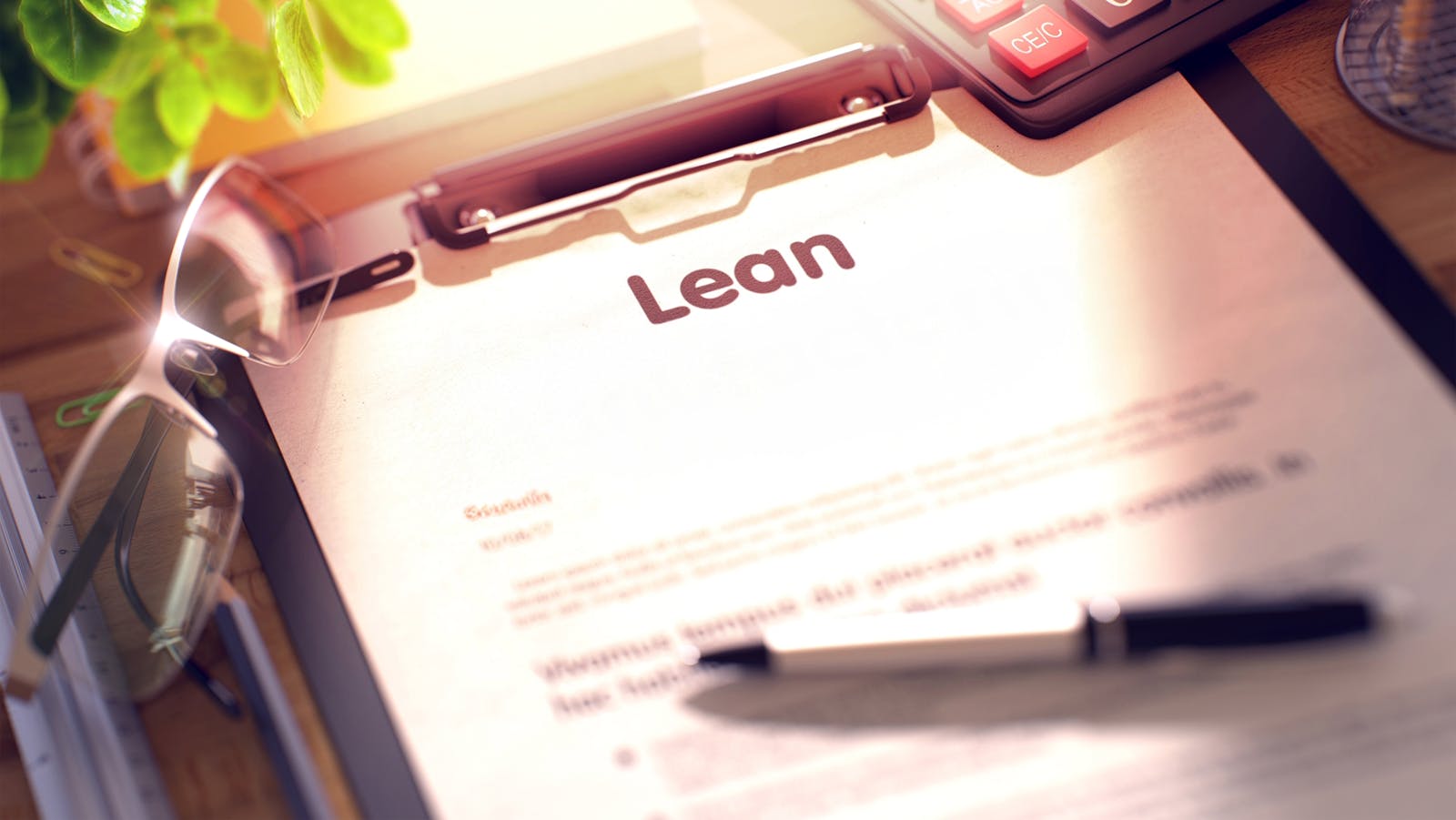Clipboard with paper saying 'lean', blurred and toned