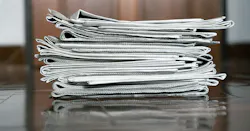 stack of newspapers stack of newspapers