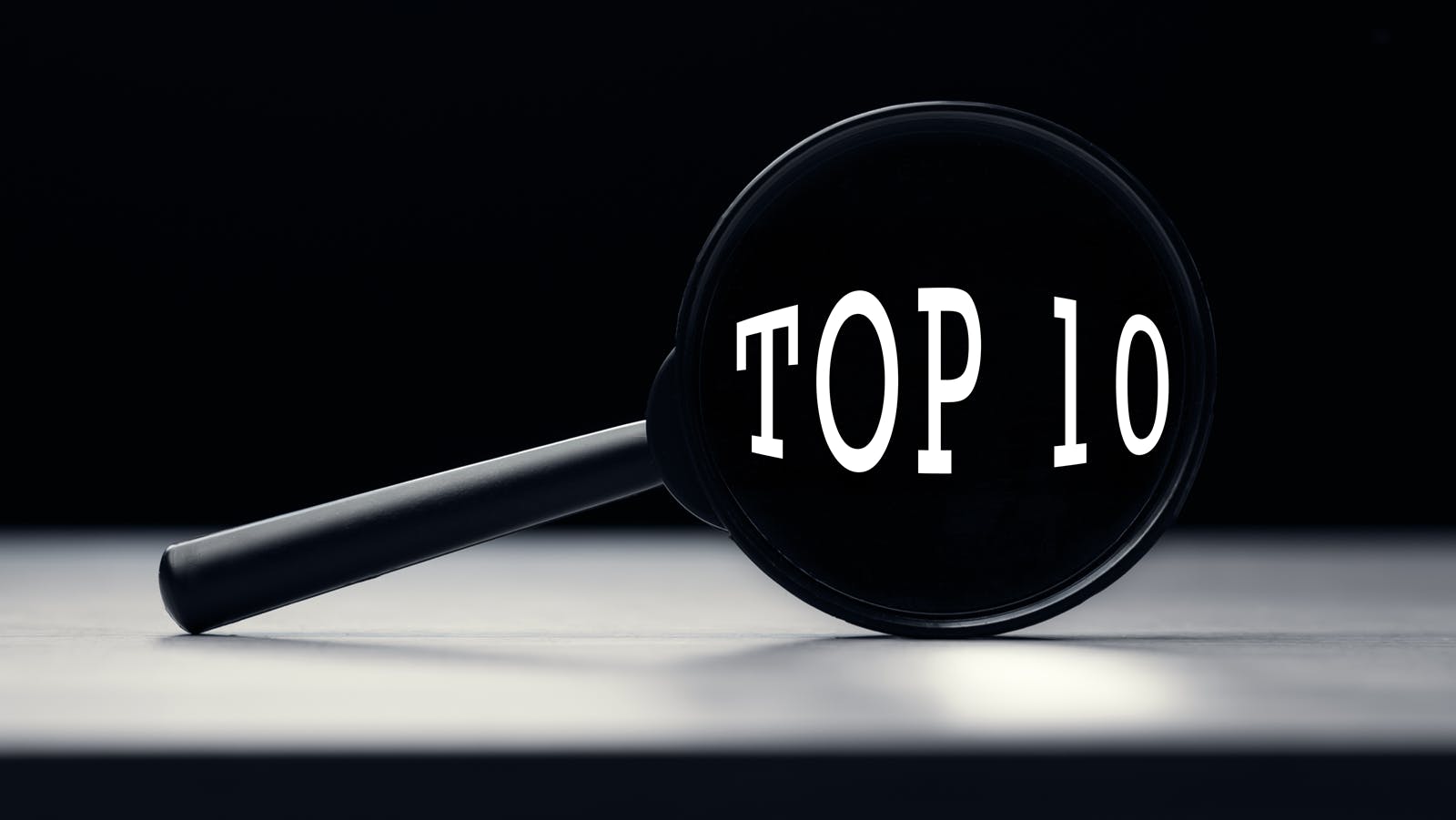 magnifying glass with the words 'top 10' in the glass part