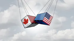 shipping containers, one Canadian and one U.S., swinging in the air