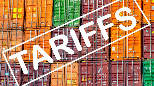 colorful shipping containers with the word 'tariffs' pasted over them