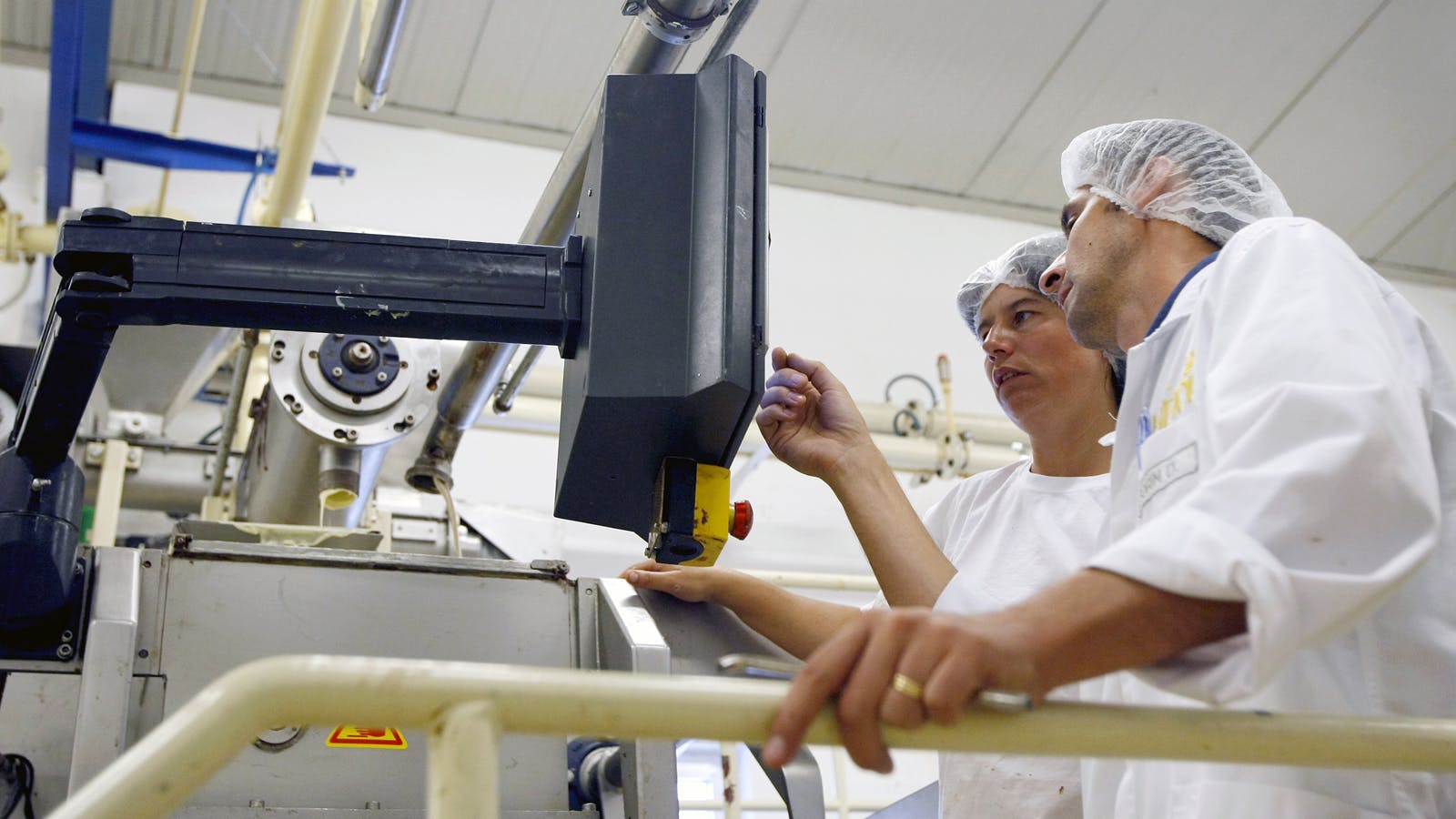 workers_on_automated_line_dreamstime_l_19138772