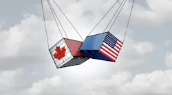 cargo swinging from chains, one is covered in US, the other with Canada