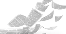 a stack of paper being blown around