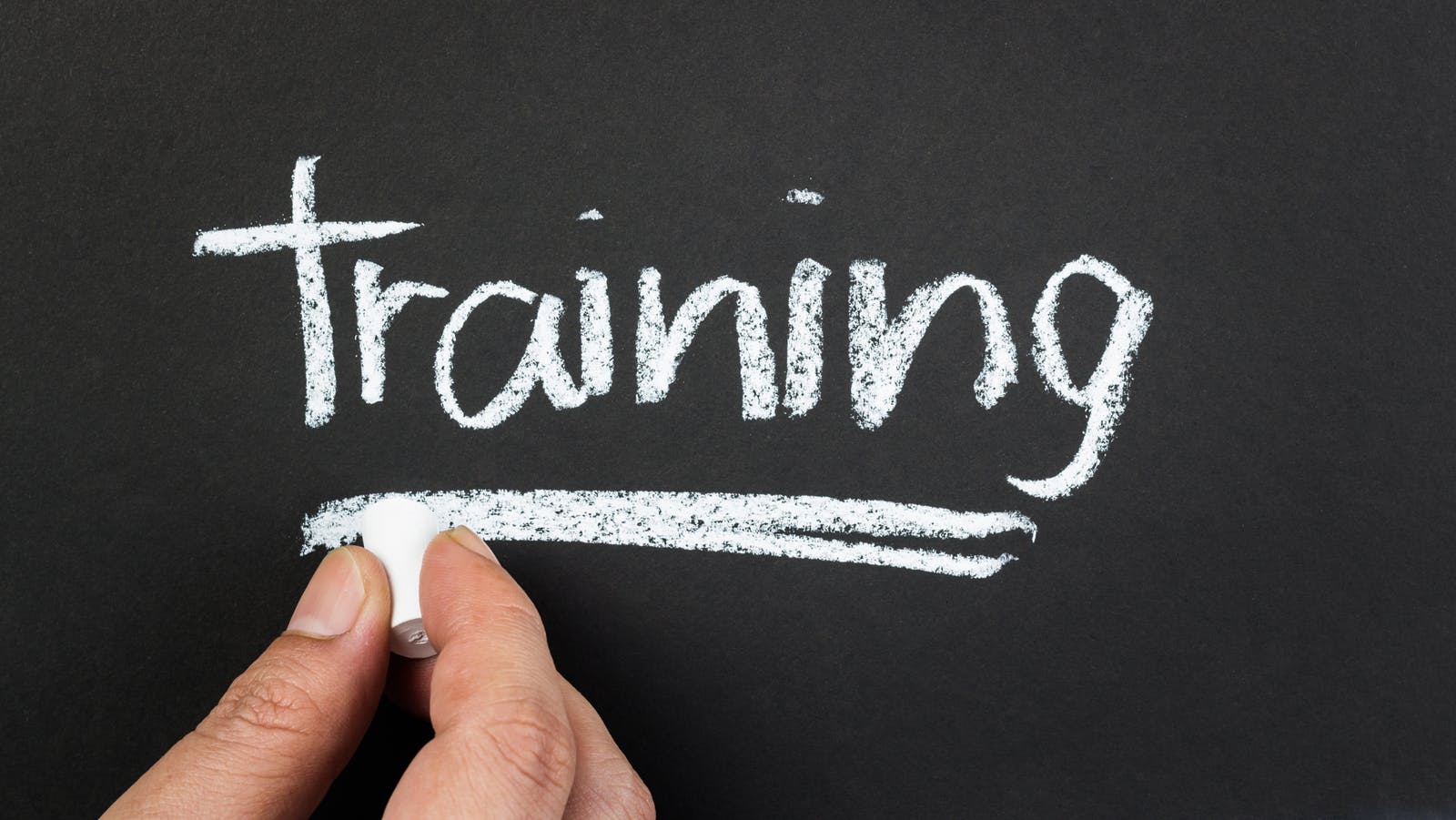 the word 'training' written on a chalkboard