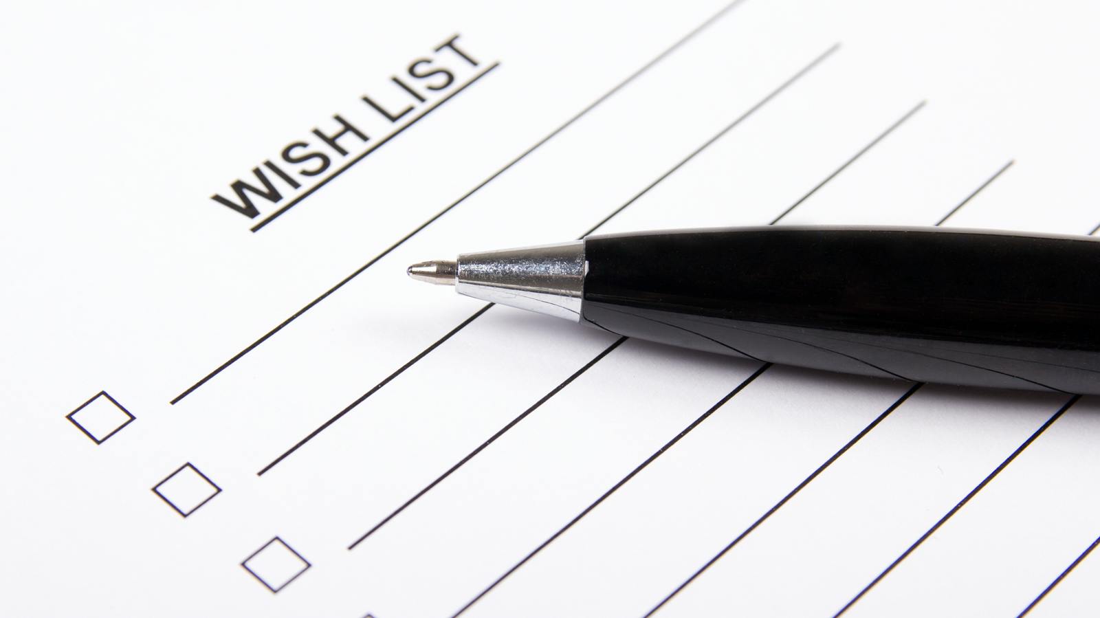 paper that says wish list at the top, with pen on top of it