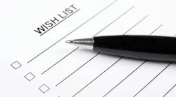 paper that says wish list at the top, with pen on top of it