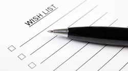 paper that says wish list at the top, with pen on top of it