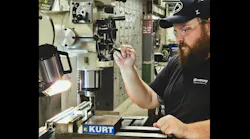 Sam Stoltzfus at a machine