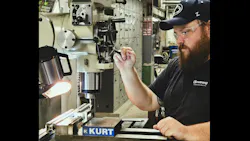 Sam Stoltzfus at a machine