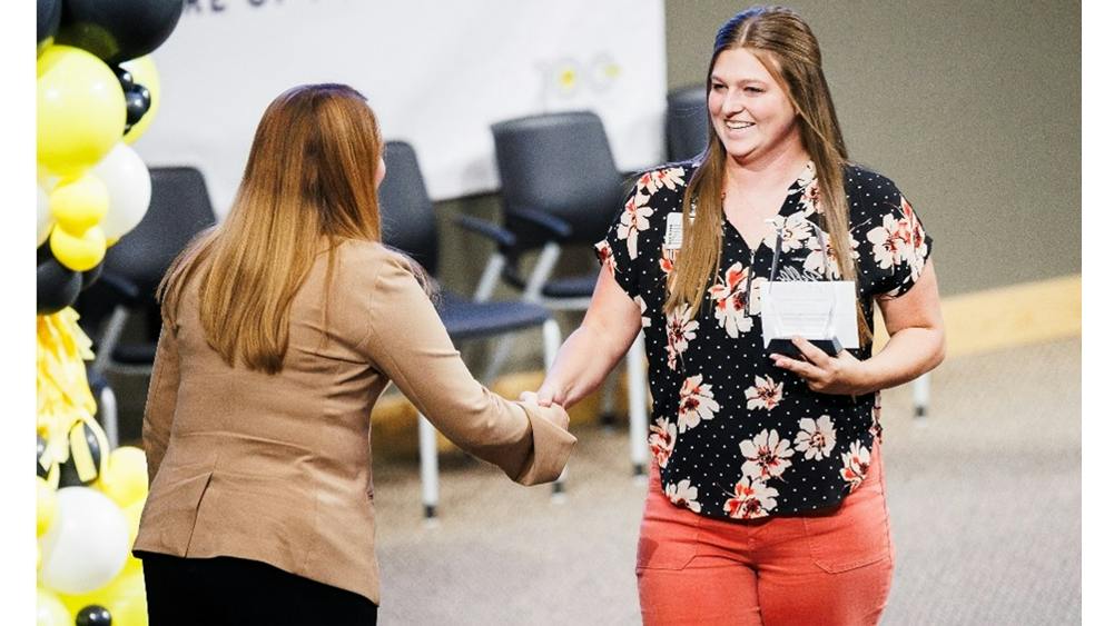 hannah bennett, at right, receives award