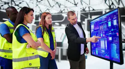 people gathered around a whiteboard covered in data